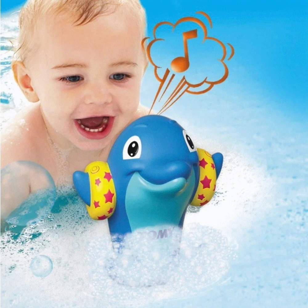 TOMY Water Whistlers Purple Dolphin Bath Toy E72379 Squirter Whistle 9m+
